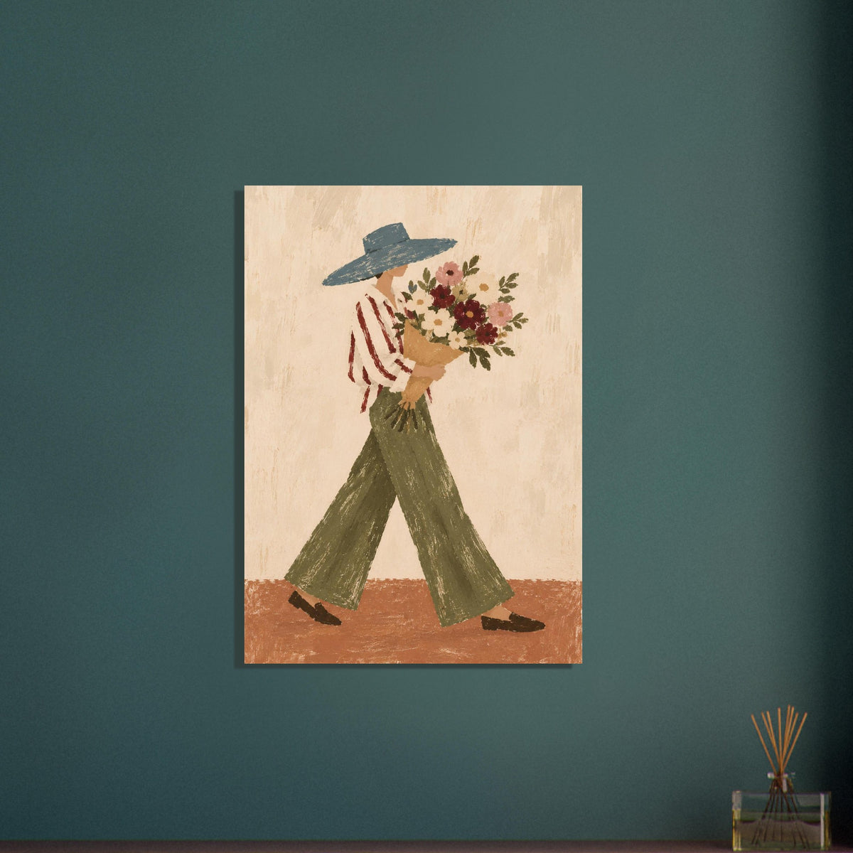 A vertical canvas art print depicting a folk-art style figure in a blue hat, red-and-white striped shirt, and green pants carrying a bouquet of flowers, displayed on a dark teal wall.