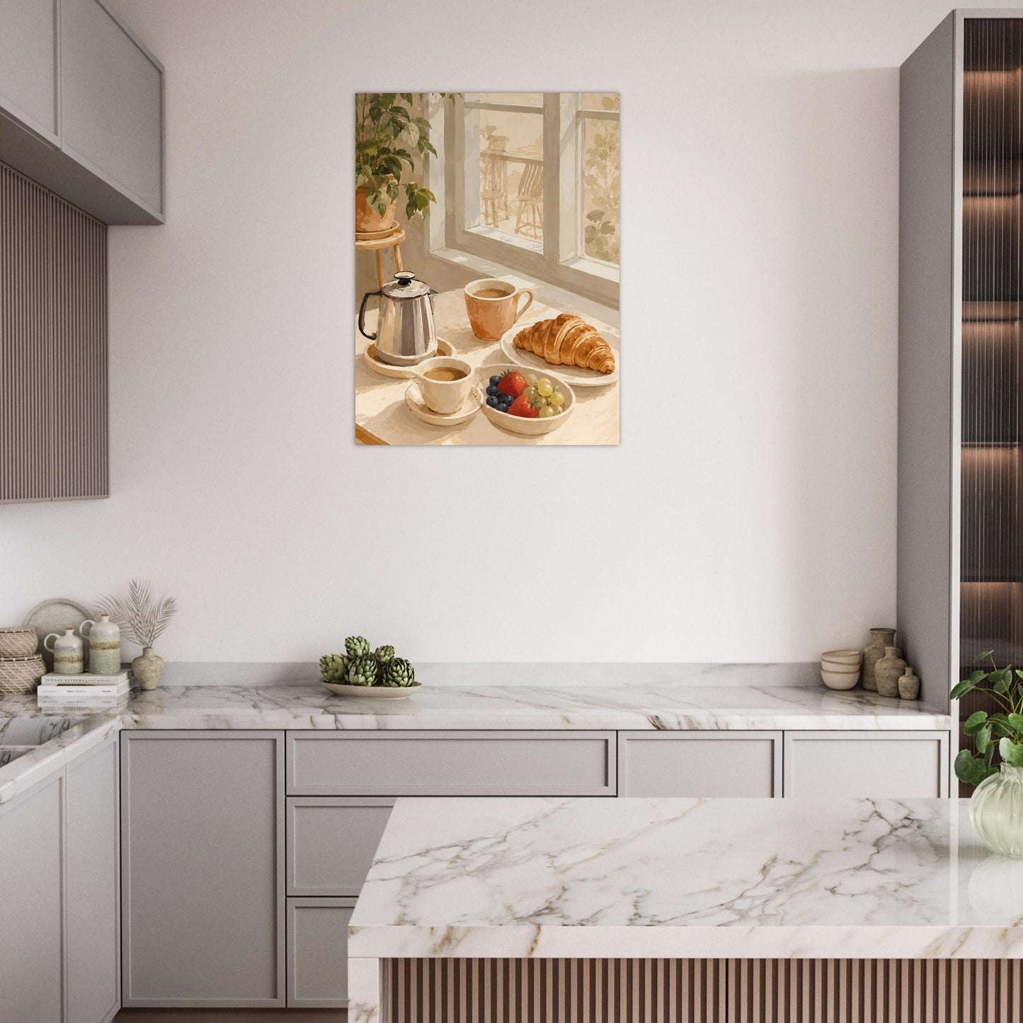Modern kitchen with marble island and light gray cabinets, featuring a wall art of a breakfast scene.