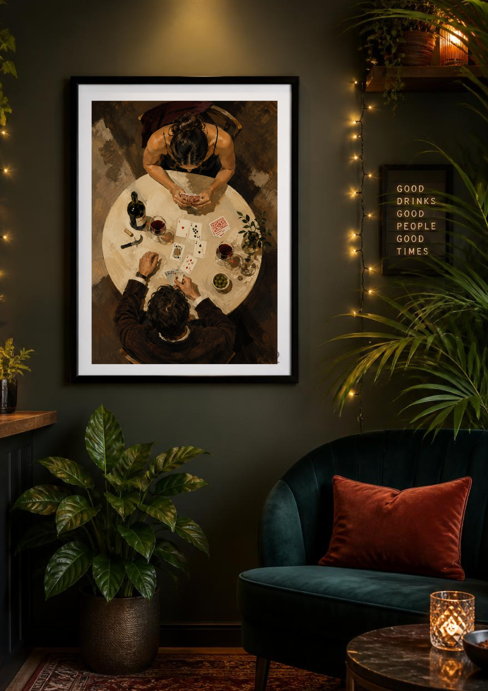 Framed couple wall art with wine and playing cards styled in a dark green eclectic interior.