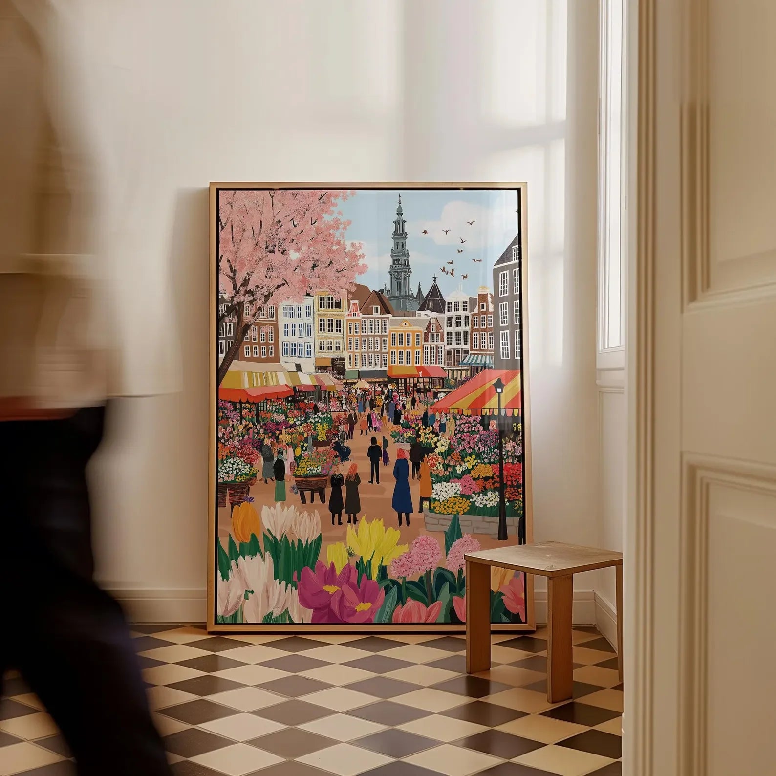 Colorful painting of a market scene in a room with checkered floor and white walls.