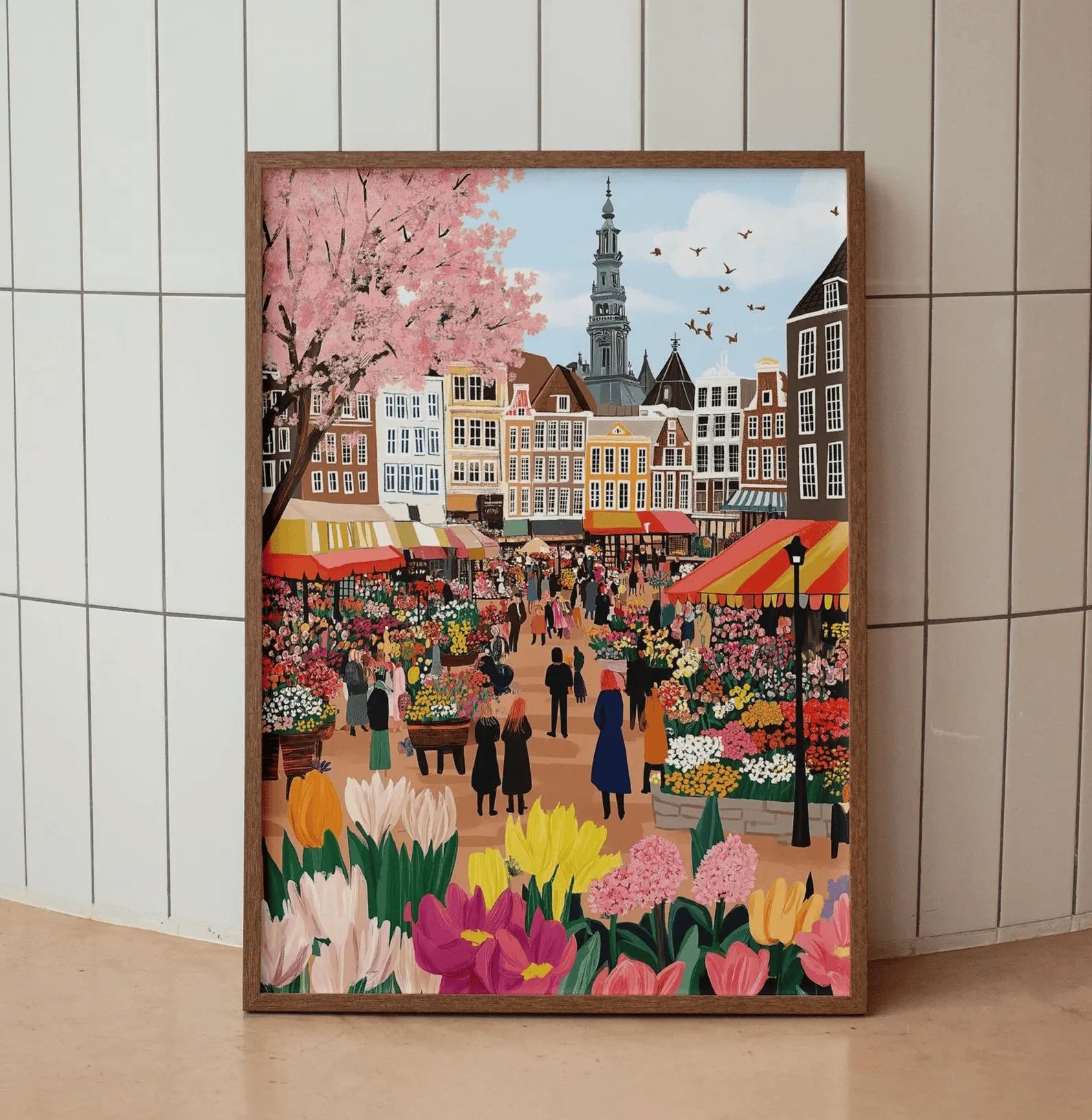 Framed artwork of a bustling market scene with flowers and buildings.