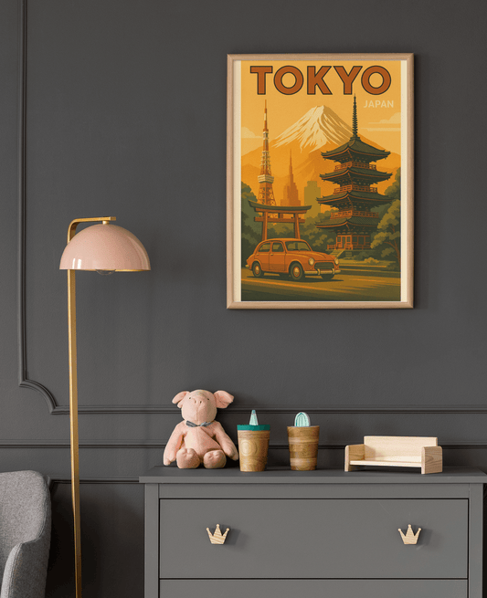 Framed vintage Tokyo travel poster with Mount Fuji and classic Japanese architecture, displayed in a dark modern nursery with matching furniture.