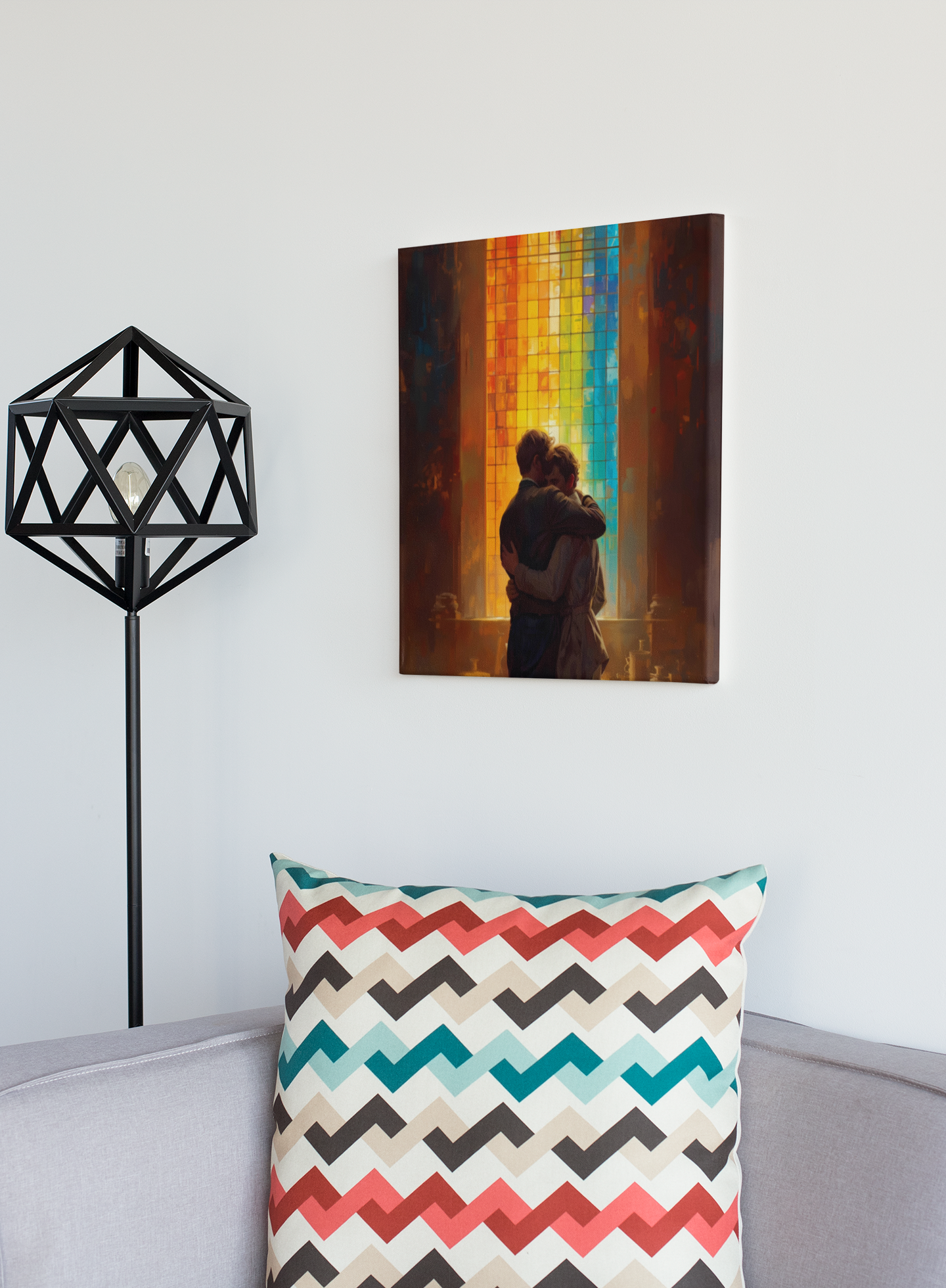 Canvas print of a couple embracing on a wall above a sofa with a colorful pillow.
