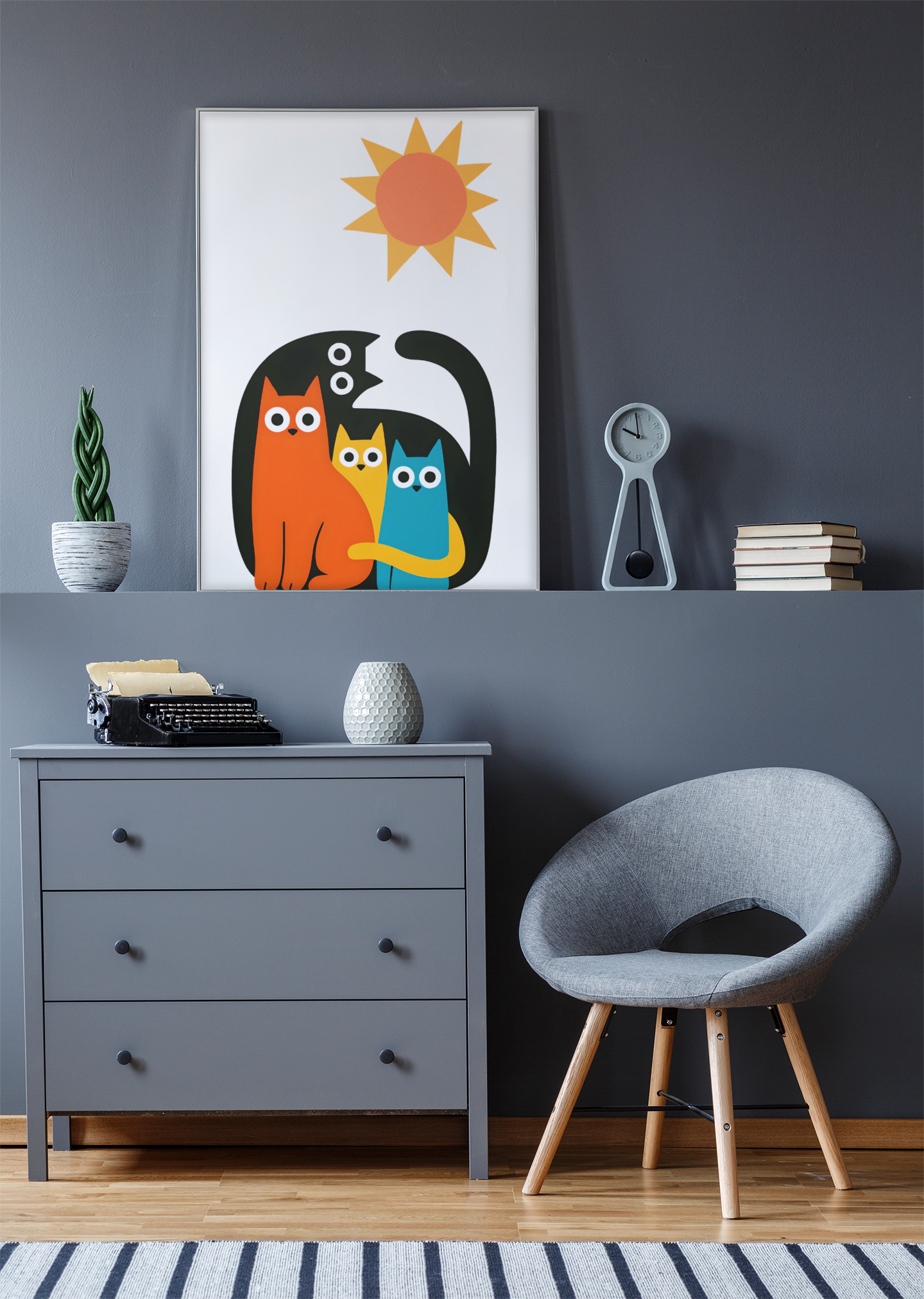 Modern interior with a gray chair, dresser, and colorful abstract art on a gray wall.