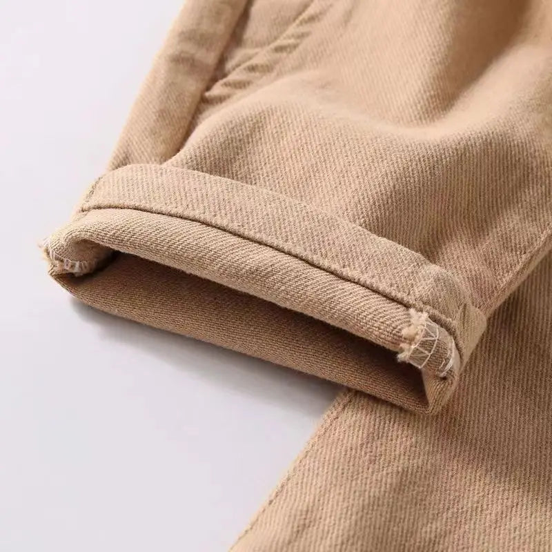 Close-up of beige fabric with a white background