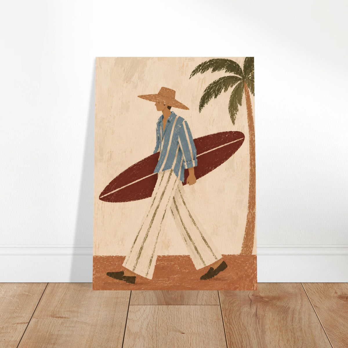 A vertical art print featuring a retro-style illustration of a man carrying a surfboard, leaning against a white wall on a light wood floor.
