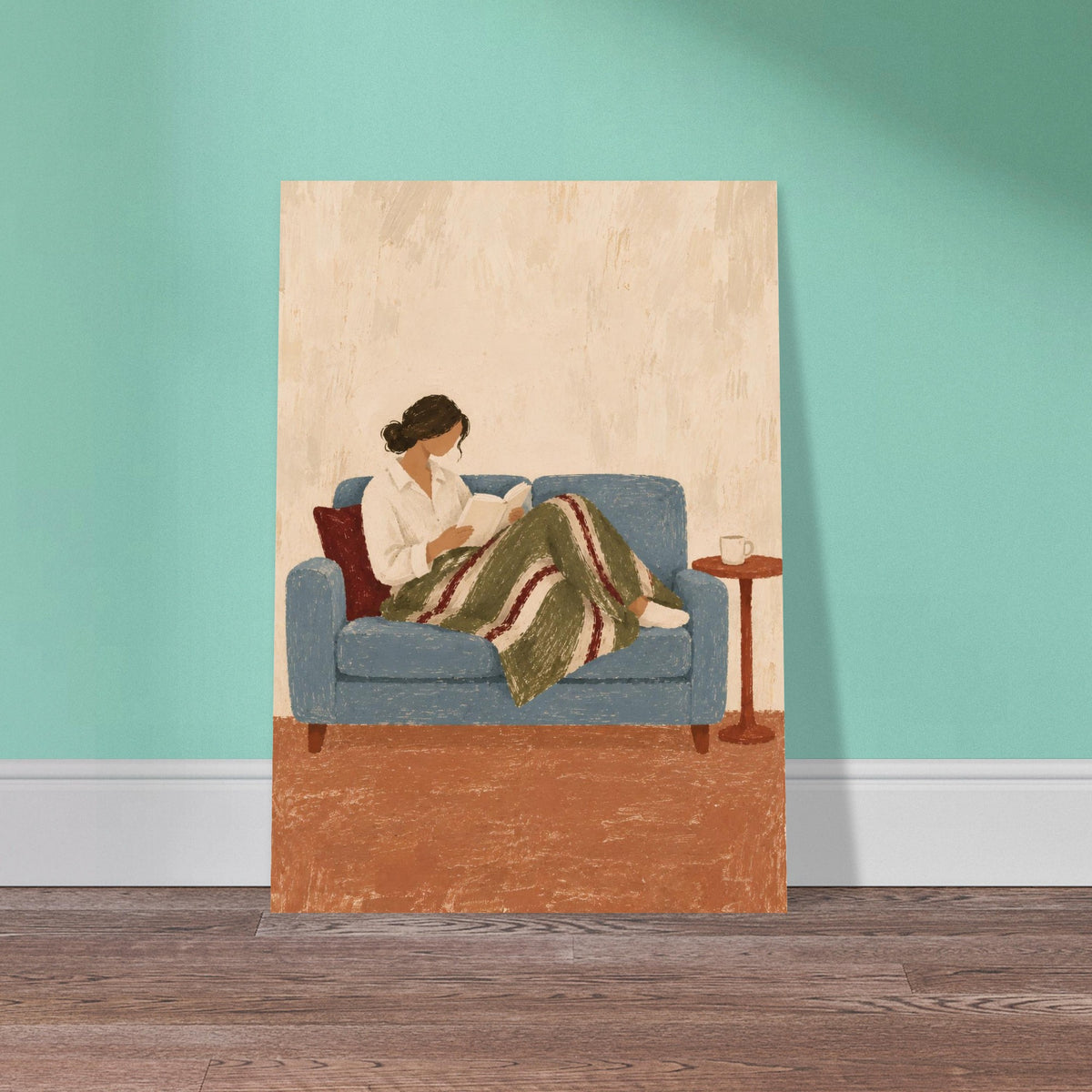 A vertical art print depicting a woman reading on a blue couch, leaning against a mint green wall on a wooden floor.