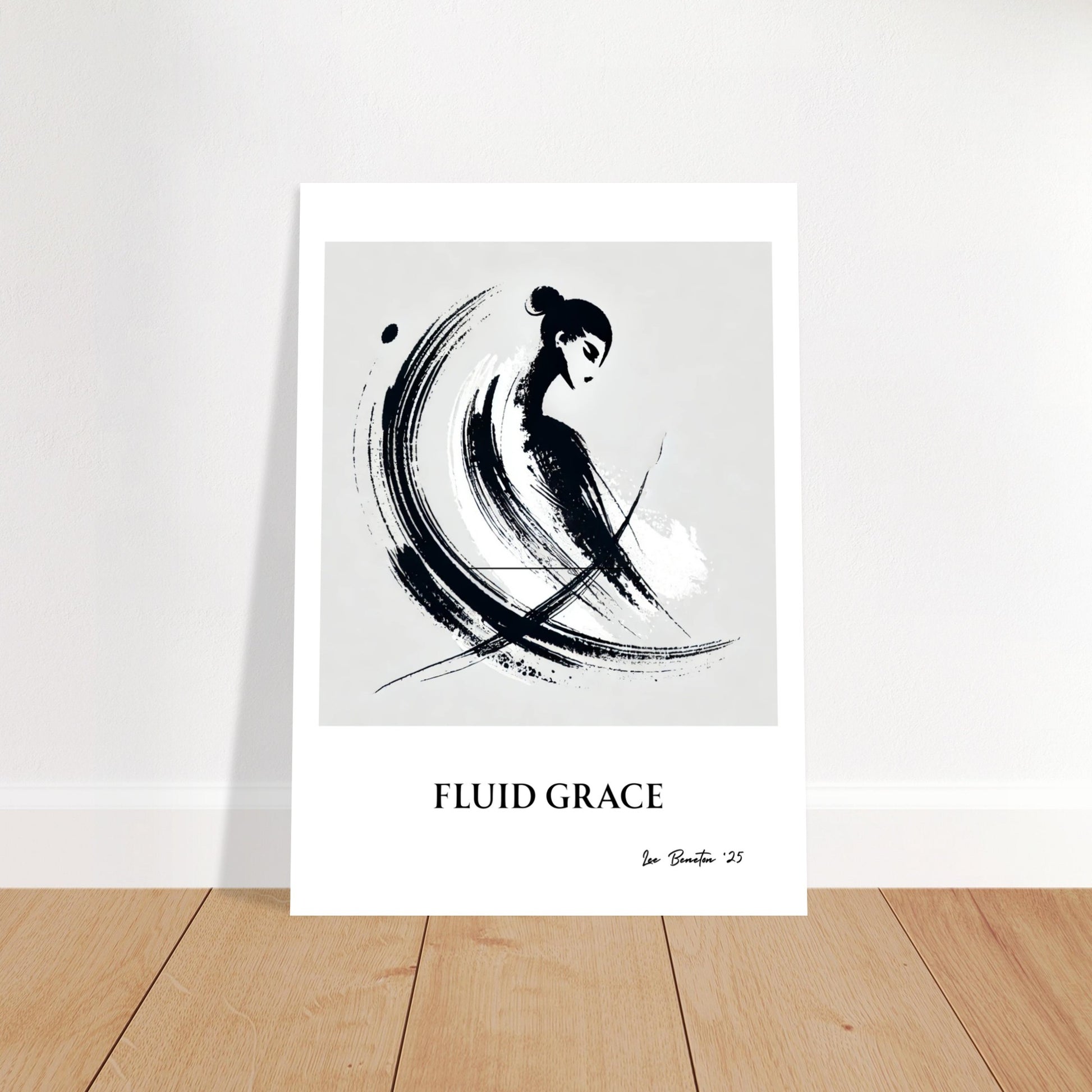 Minimalist ink brush stroke art poster leaning against wall on wooden floor, abstract black brush design on white background.