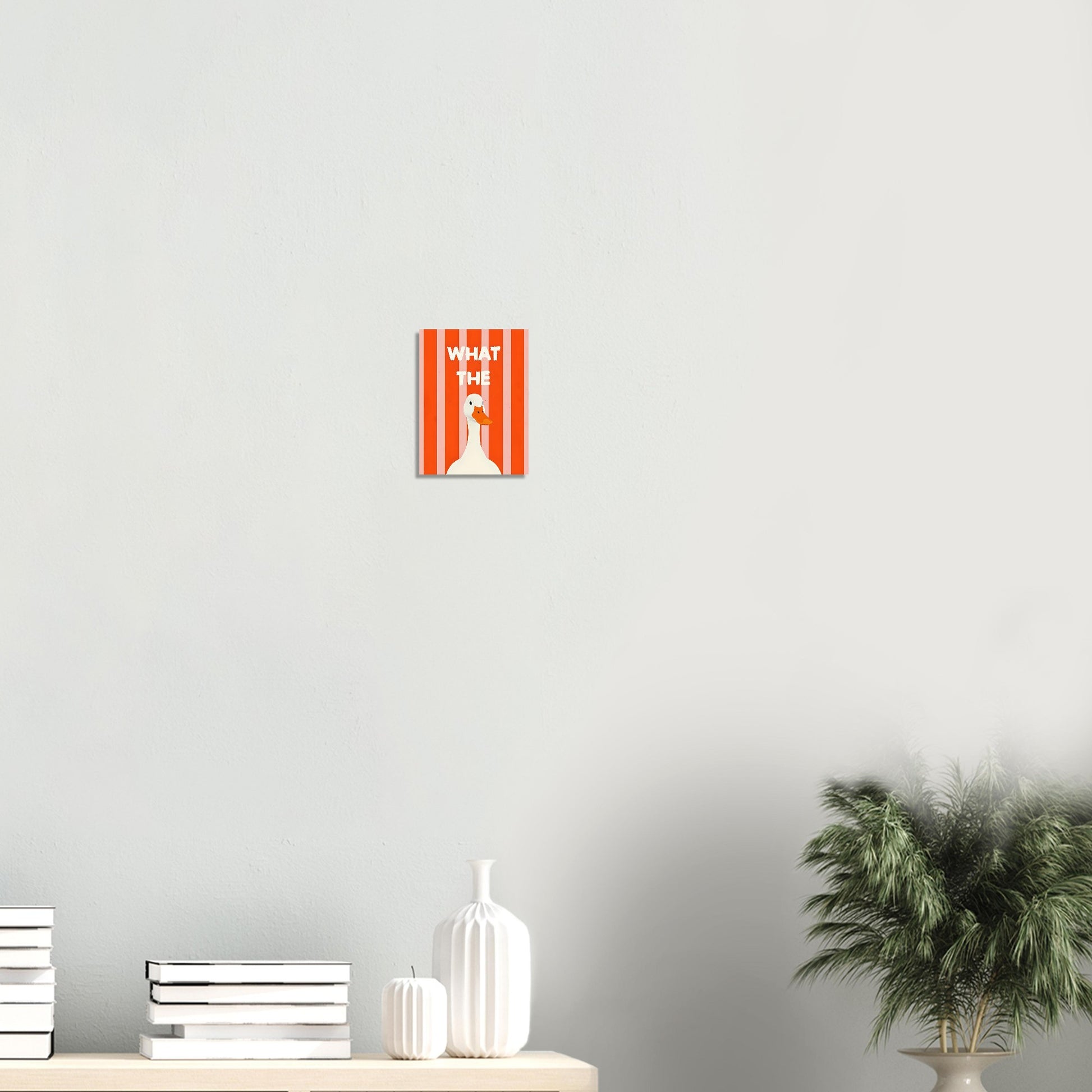 Decorative wall art with text and a silhouette on a light gray wall.