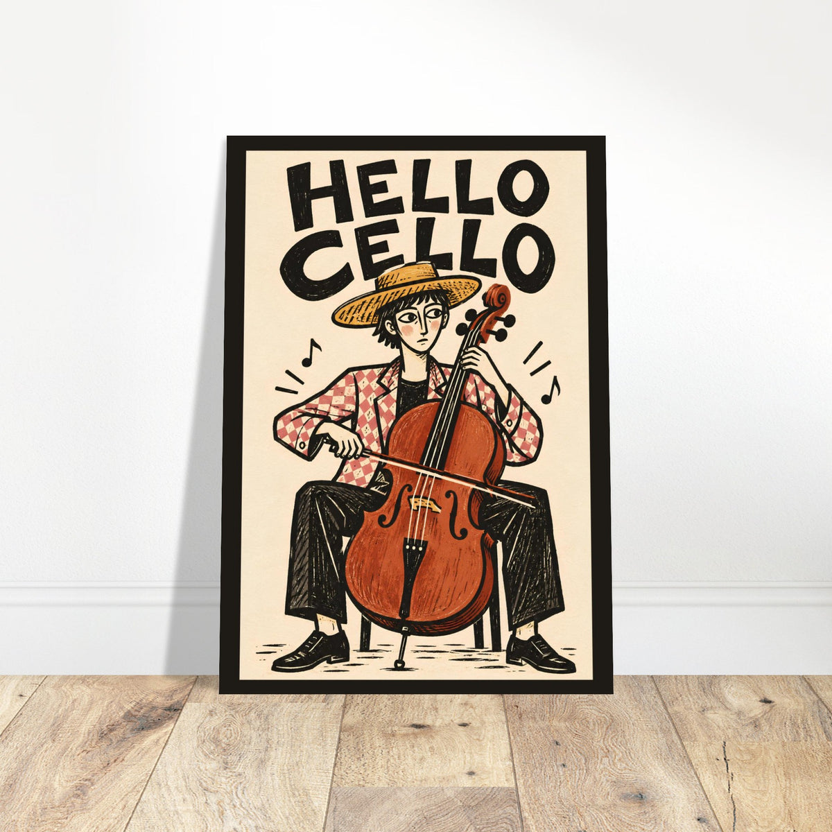 A framed art print leaning against a white wall on a light wood floor. The print features a hand-drawn style illustration of a person sitting with a cello, with the text 'HELLO CELLO' at the top.