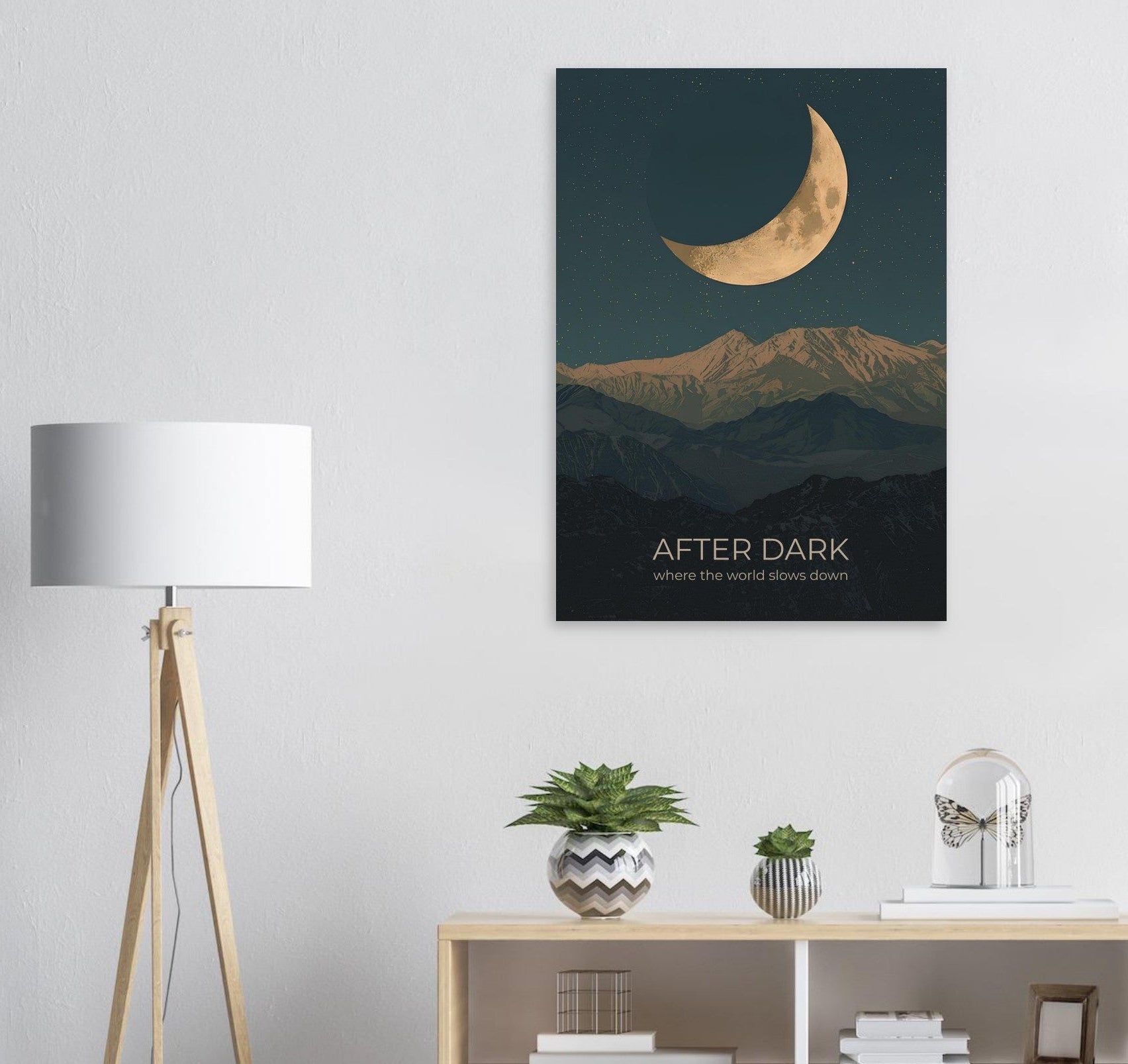 Moon wall art displayed above a modern sideboard, featuring a crescent moon and layered mountain silhouettes in calming navy hues.