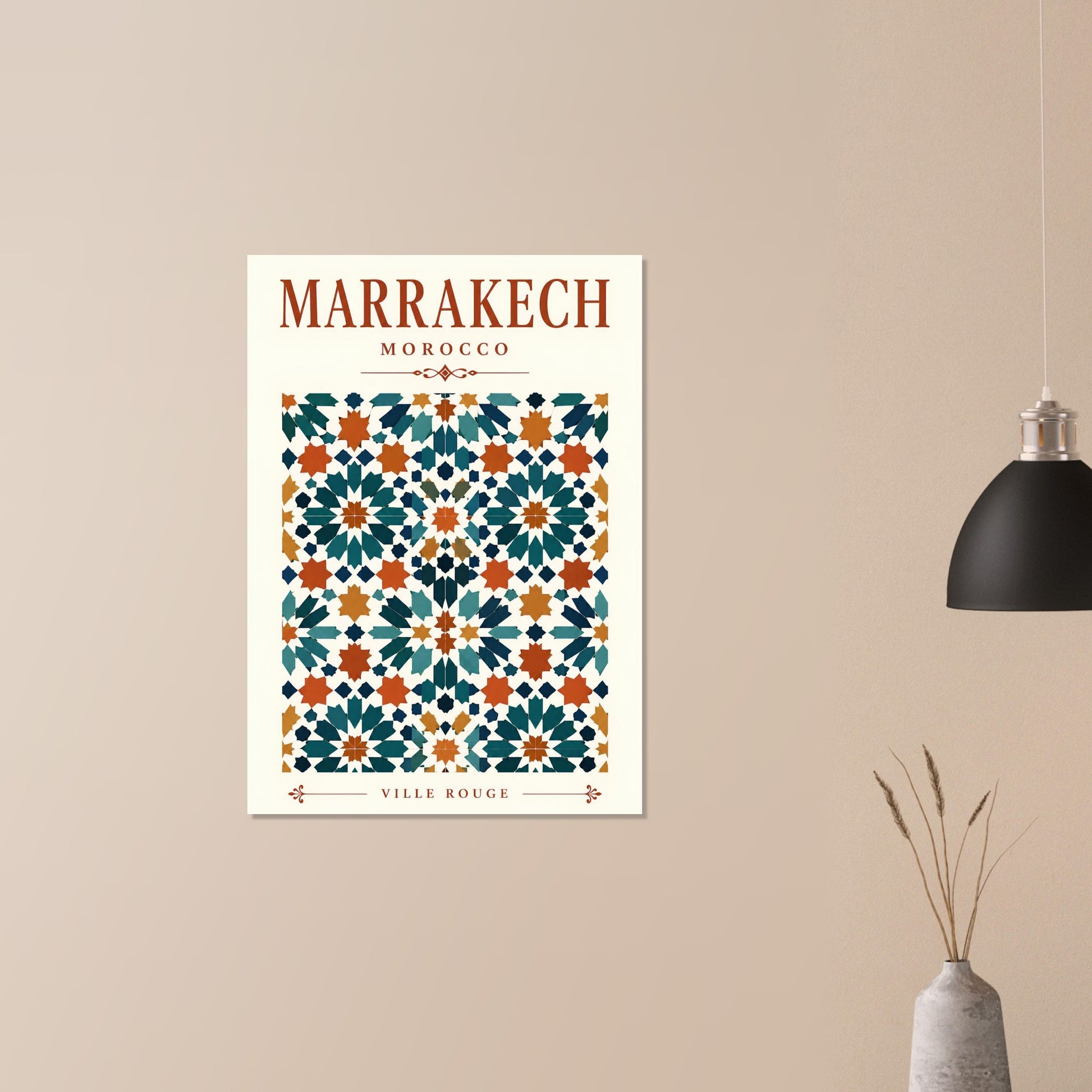 A framed wall art print featuring a Moroccan tile pattern labeled 'MARRAKECH MOROCCO' and 'VILLE ROUGE', displayed on a beige wall in a styled interior with a hanging lamp and vase.