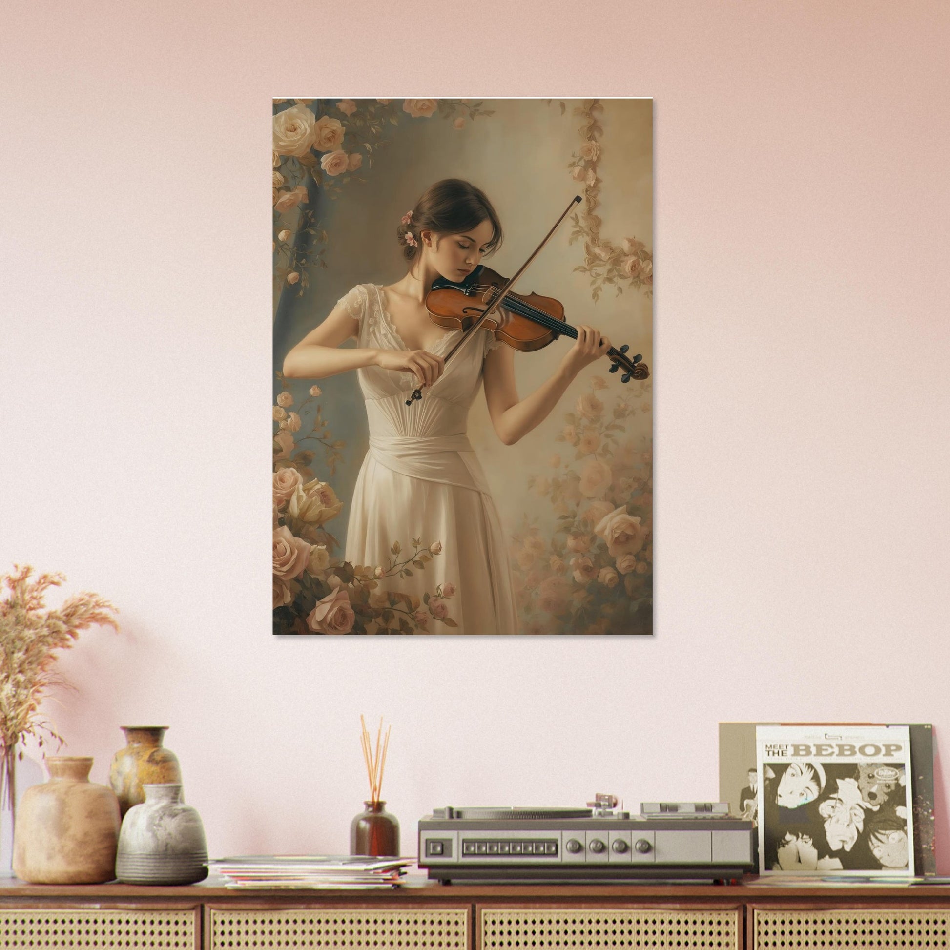 Framed artwork of a woman playing violin on a wall above a wooden shelf with decorative items.