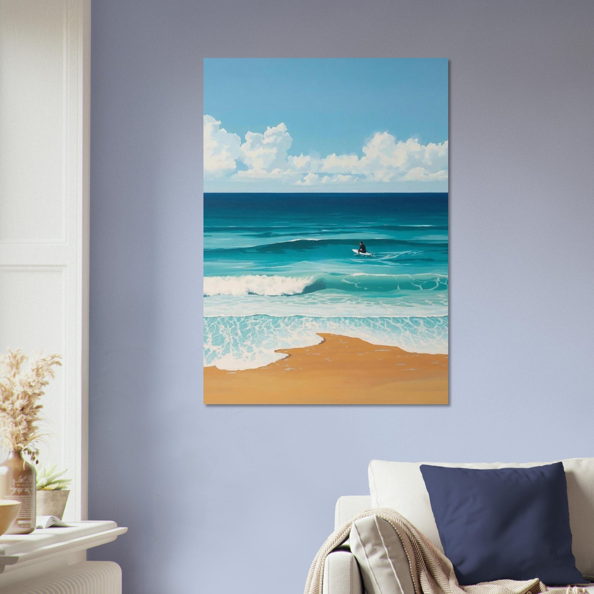 Canvas print of a beach scene with blue sky, ocean, and sand hanging on a wall.