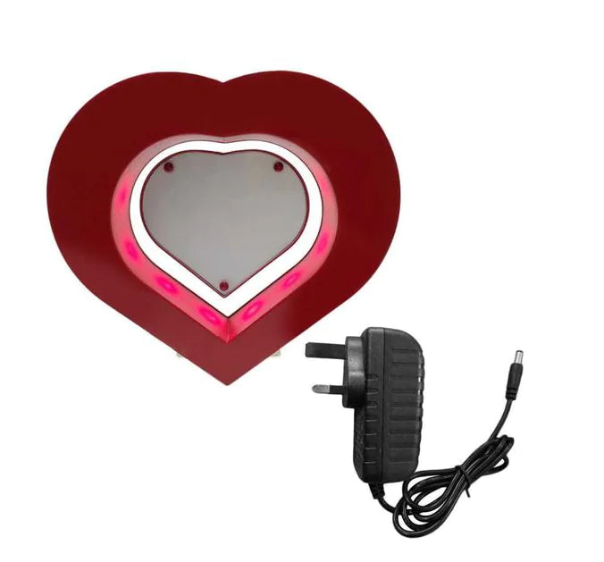 Heart-shaped light with a power adapter on a white background