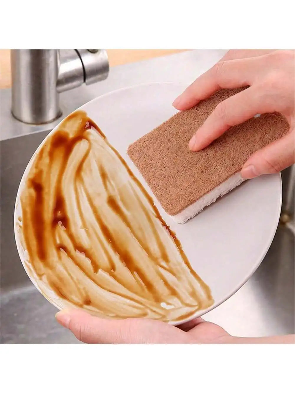 Person cleaning a stained plate with a natural cellulose scrub sponge