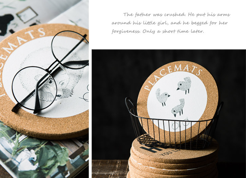 Cork placemats with animal illustrations on a magazine and a black background.