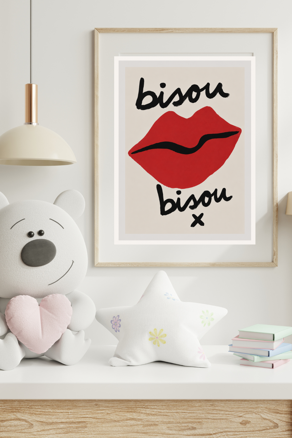 Framed artwork with red lips and 'bisou bisou' text on a shelf with decorative items.
