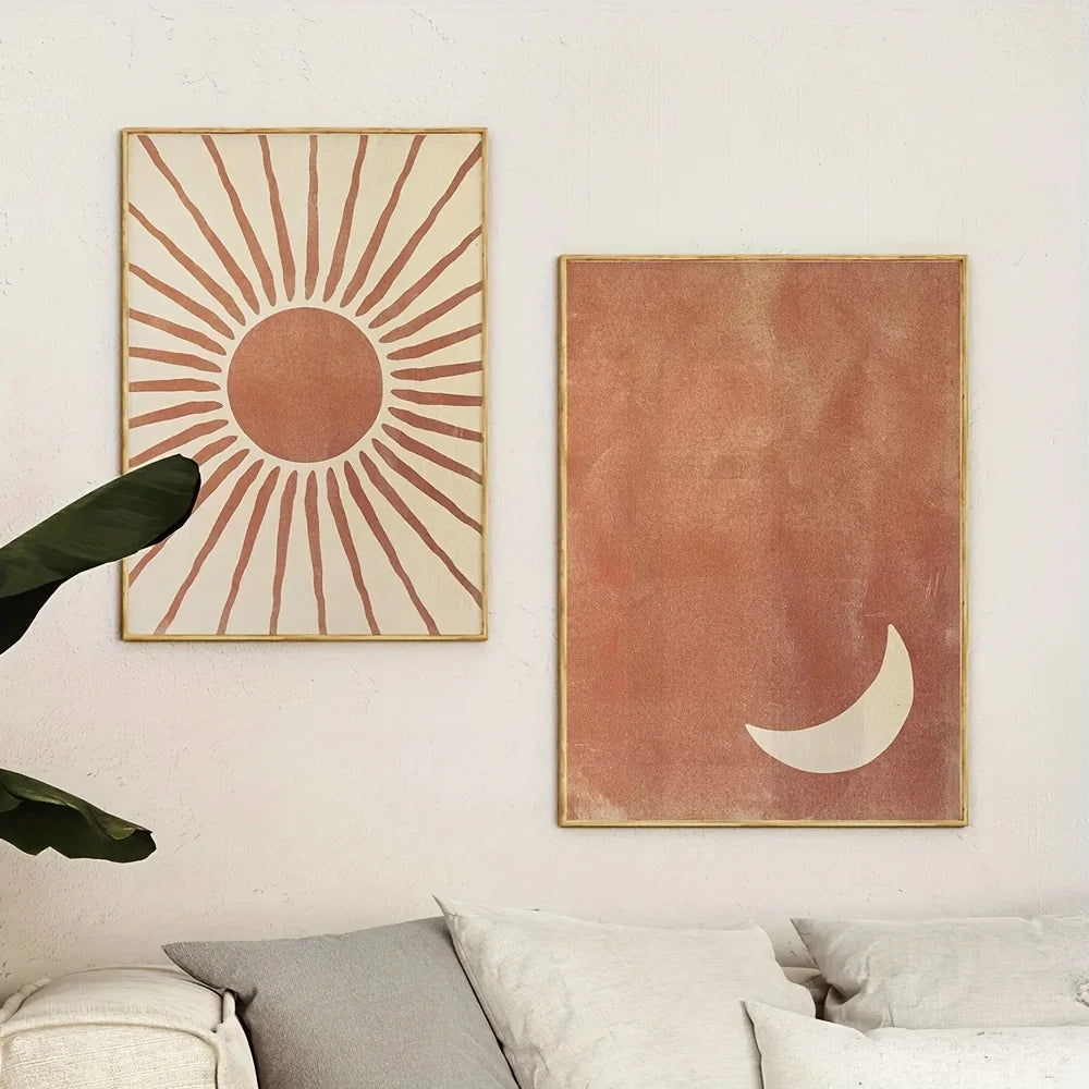 Two abstract wall art pieces on a wall above a sofa.