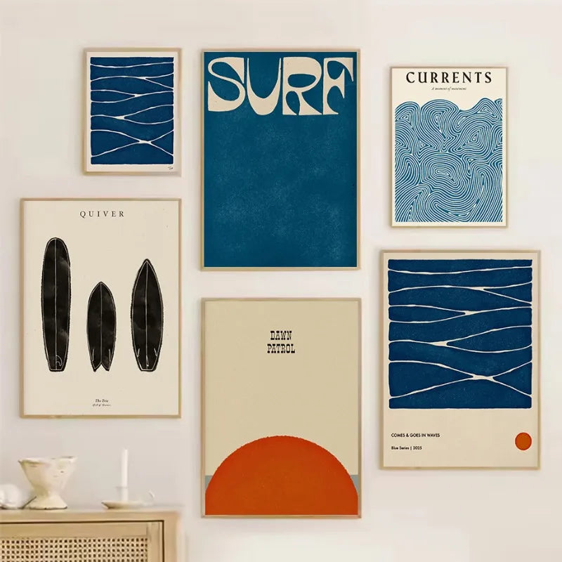 Collection of framed posters on a wall with surf theme