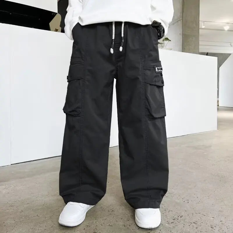 Boys streetwear trousers showing relaxed fit and elastic waistband.
