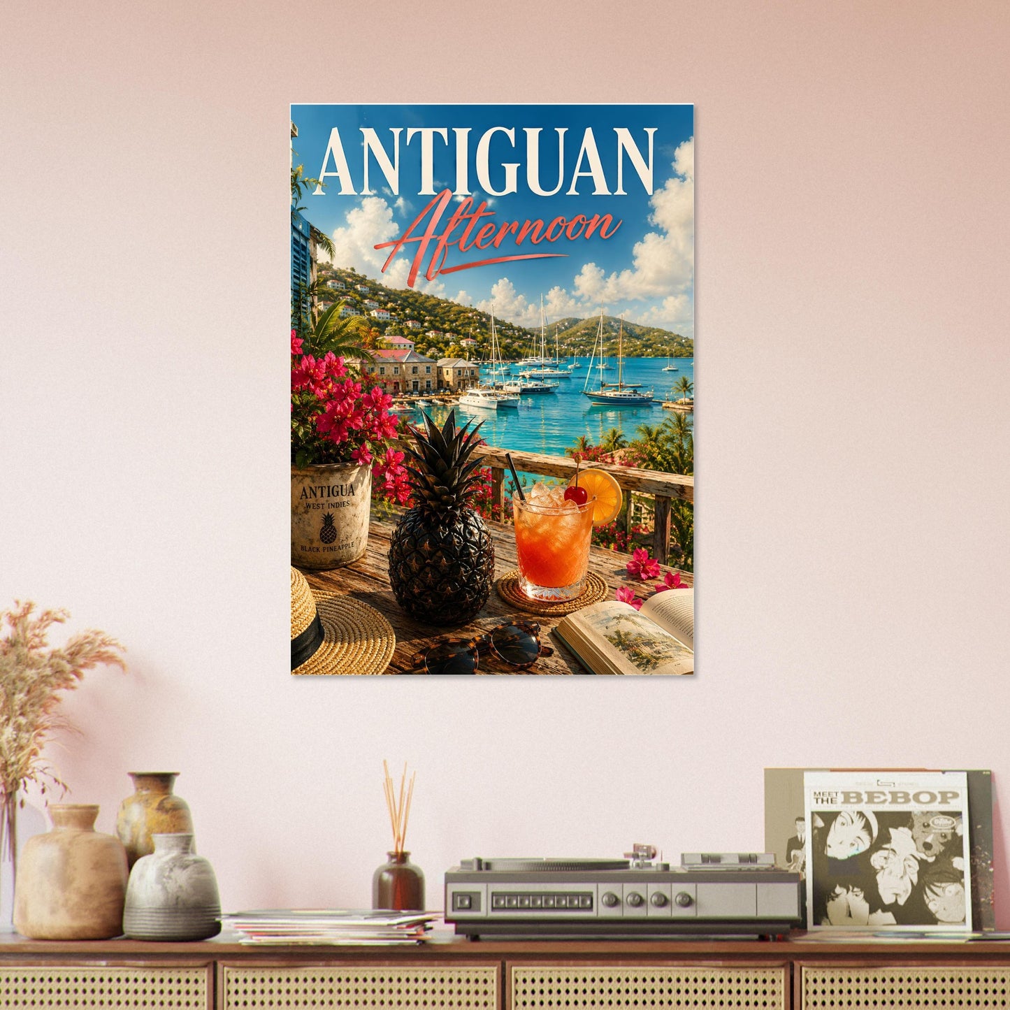 Poster titled 'Antiguan Afternoon' on a wall above a wooden shelf with decorative items.