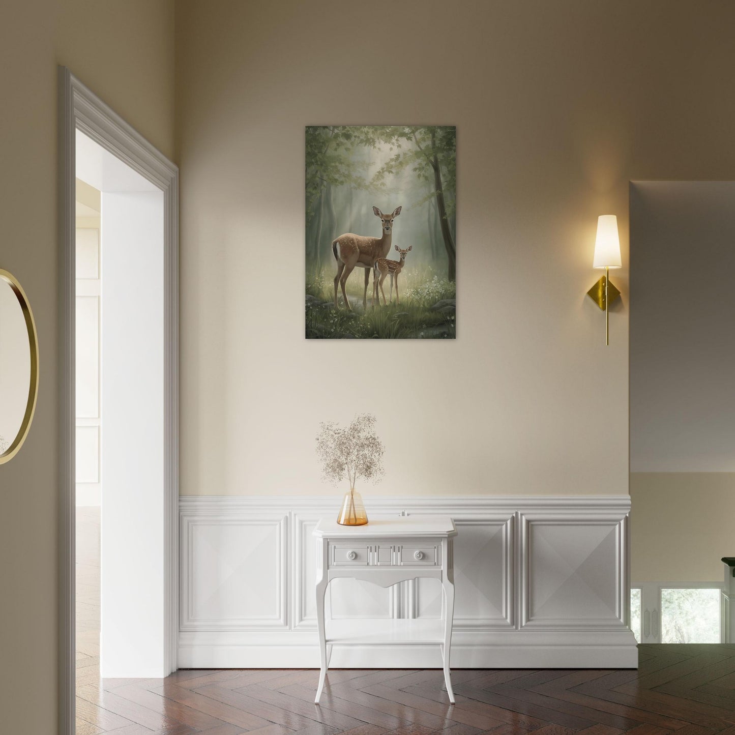 Framed artwork of deer in a forest on a wall above a white console table.