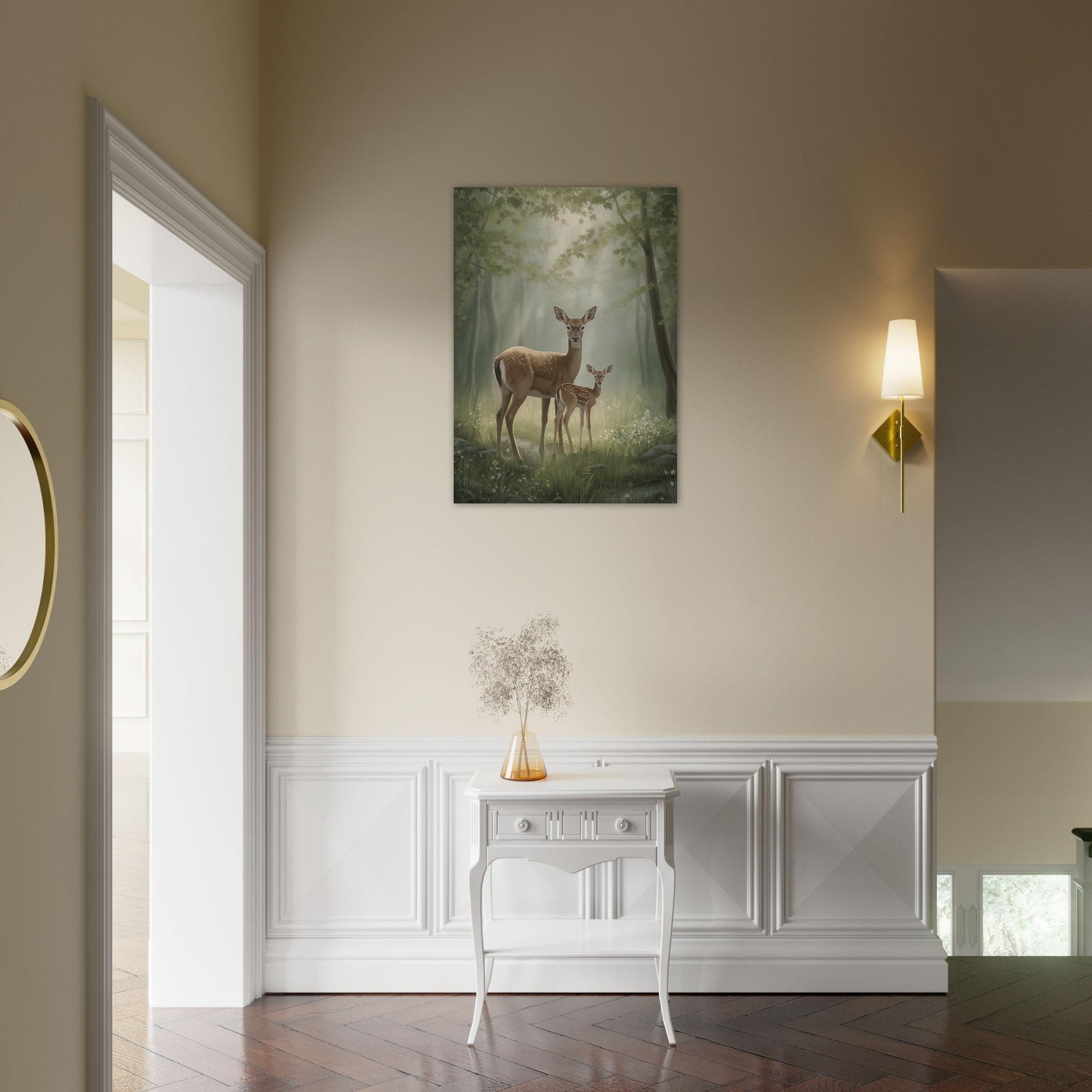 Framed artwork of deer in a forest on a wall above a white console table.