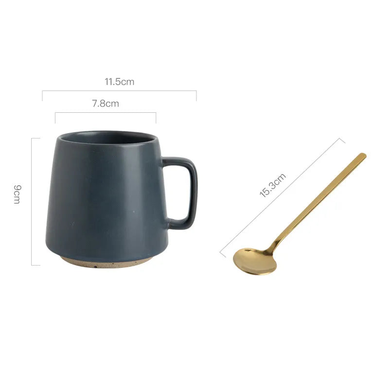 Black mug and gold spoon with measurements on a white background