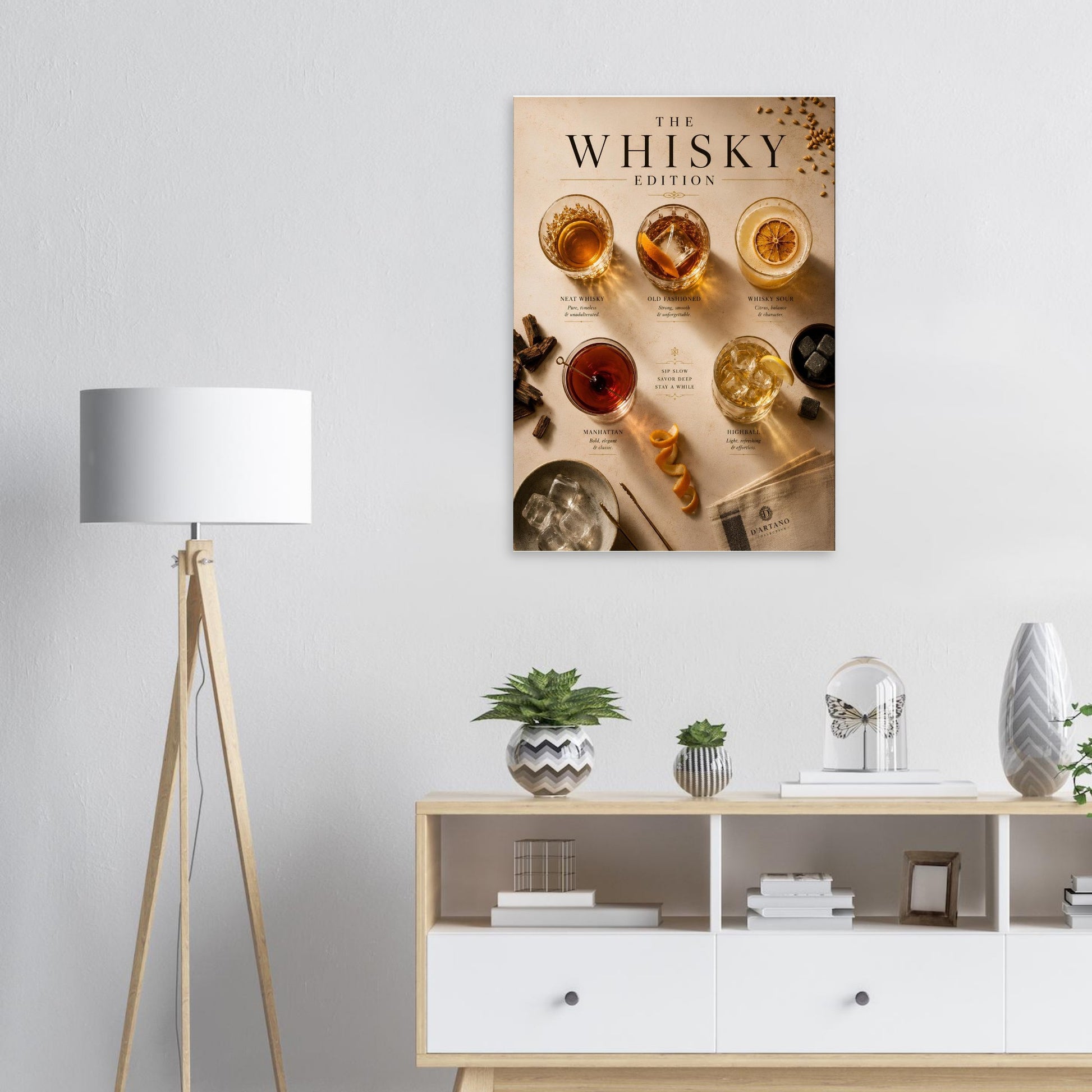 Poster titled 'The Whisky Edition' on a wall above a wooden cabinet with decorative items.