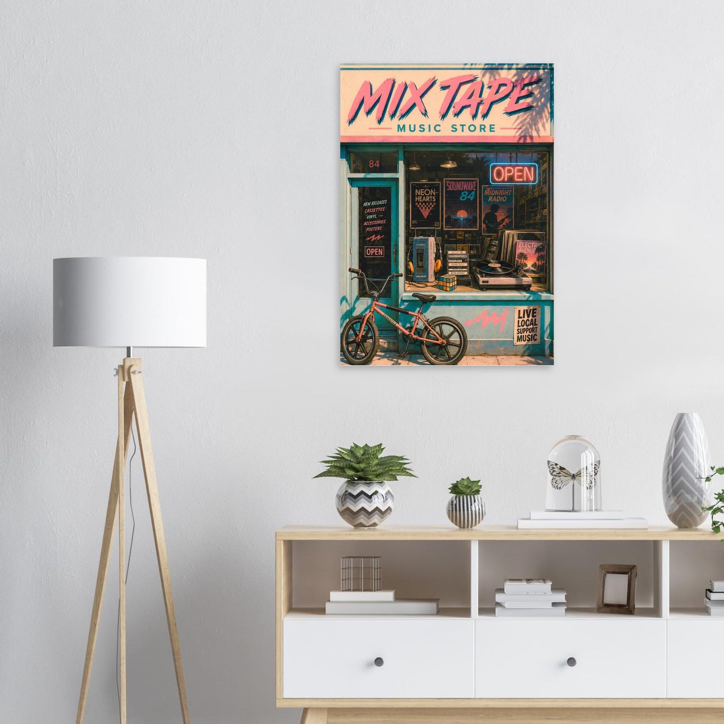 Framed poster of a 'Mix Tape Music Store' on a wall above a shelf with decor items.