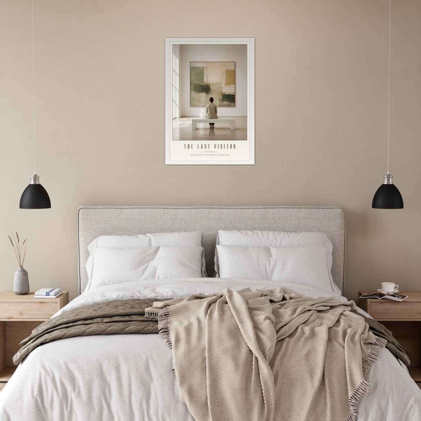 Neatly made bed with beige blanket and pillows in a bedroom setting with a framed poster of The Last Visitor.