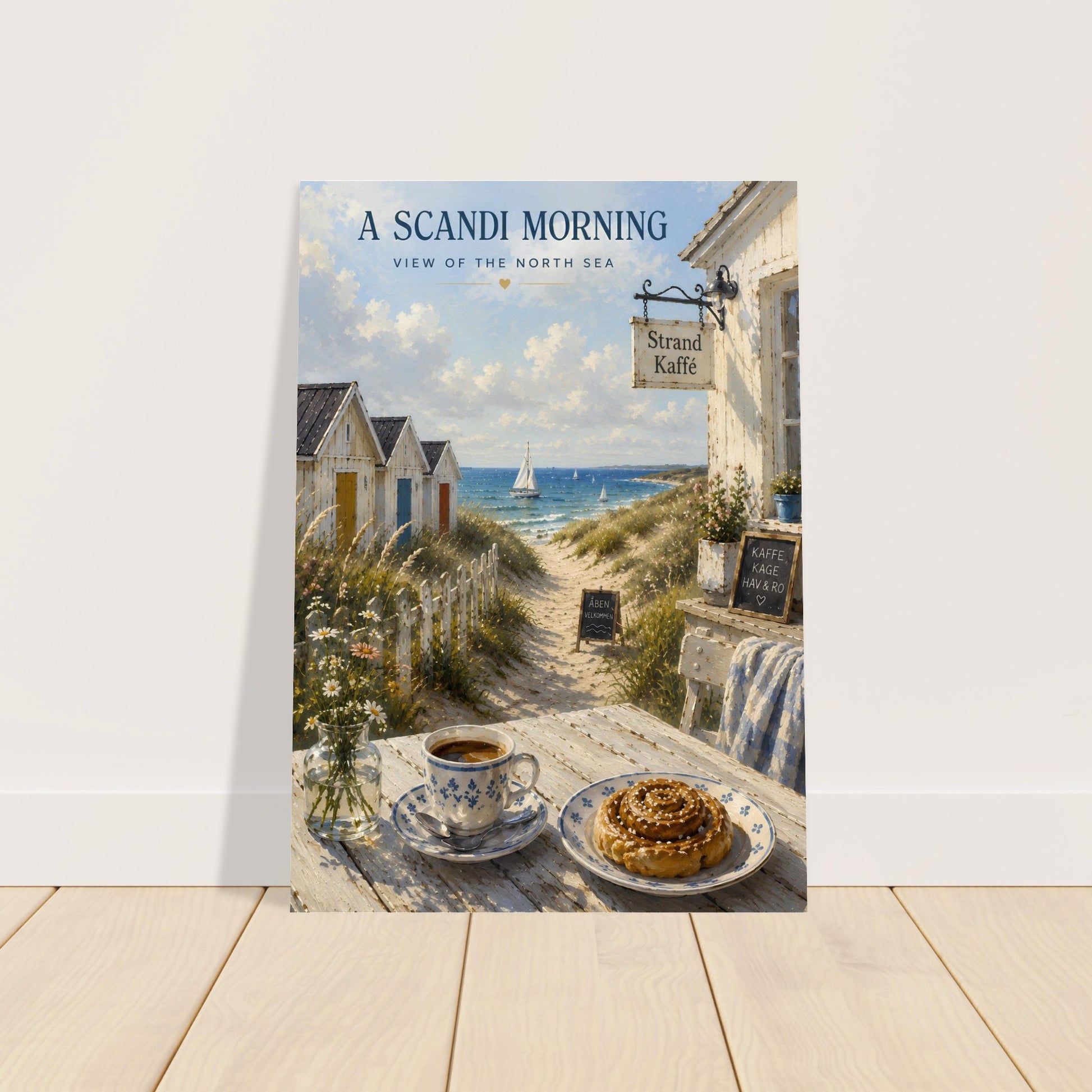Framed Scandinavian coastal poster leaning against a wall on a wooden floor