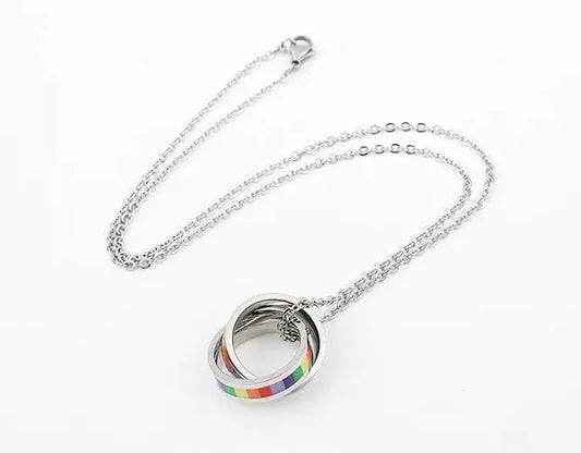 Silver titanium steel necklace with a round interlocking pendant featuring rainbow stripes, displayed on a white background