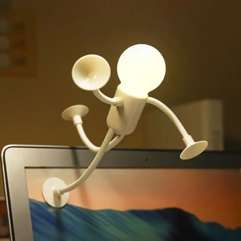 Light bulb character attached to a laptop screen with a blurred background