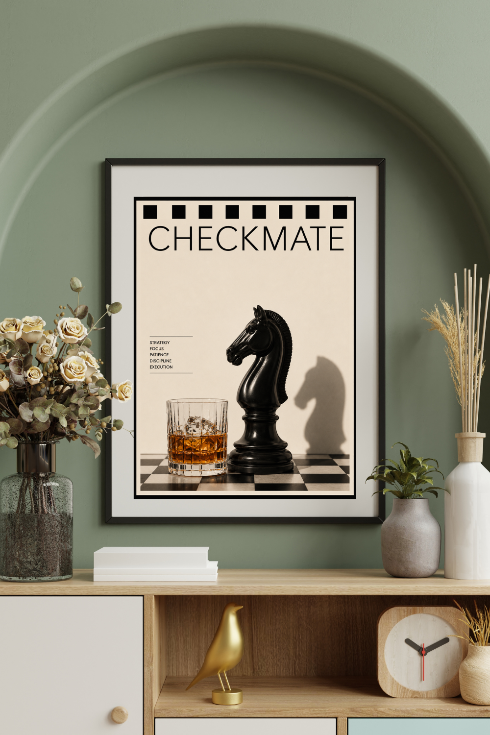Framed 'Checkmate' poster on a shelf with decorative items against a green wall.