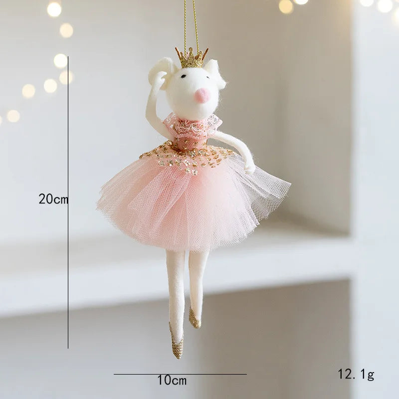 Decorative mouse ornament in a pink dress with gold accents, hanging against a light background.