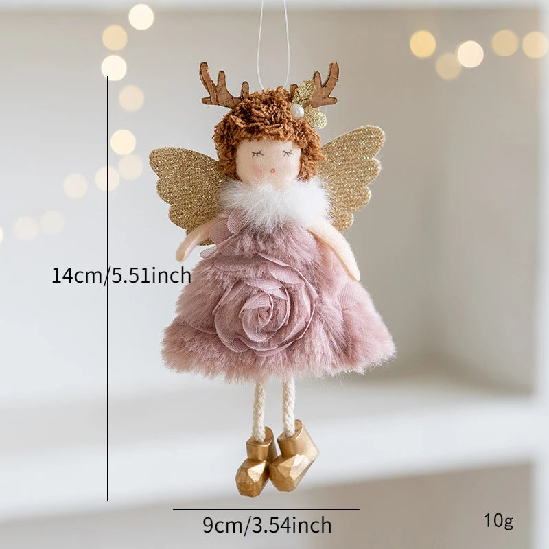Decorative angel doll with antlers and gold wings on a neutral background