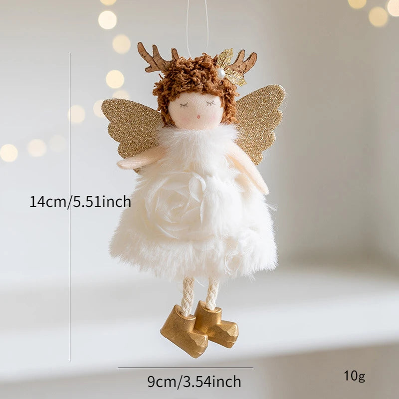 Decorative angel figurine with gold wings and antlers, hanging against a soft background.