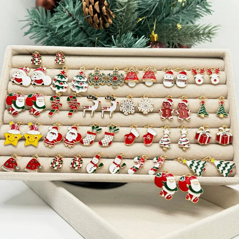 Collection of Christmas-themed earrings on a display tray with a festive background.