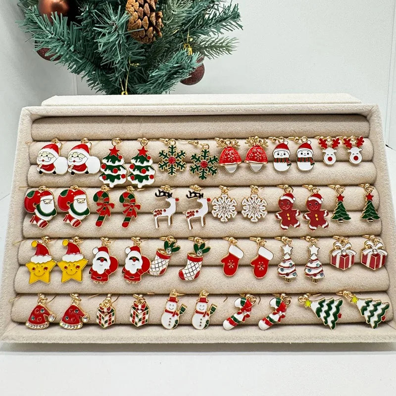 Collection of Christmas-themed earrings on a display stand with a decorative background.