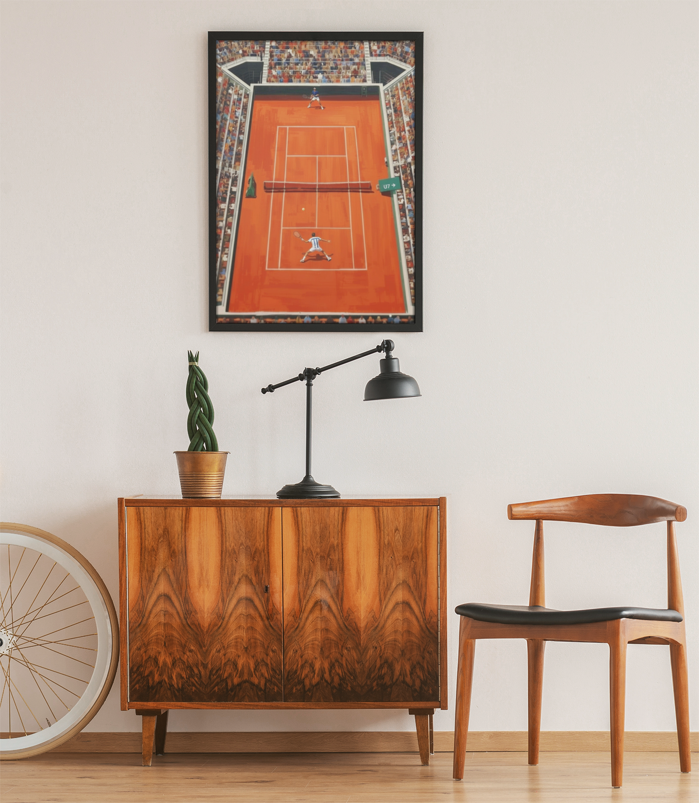 tennis wall art styled above wooden cabinet