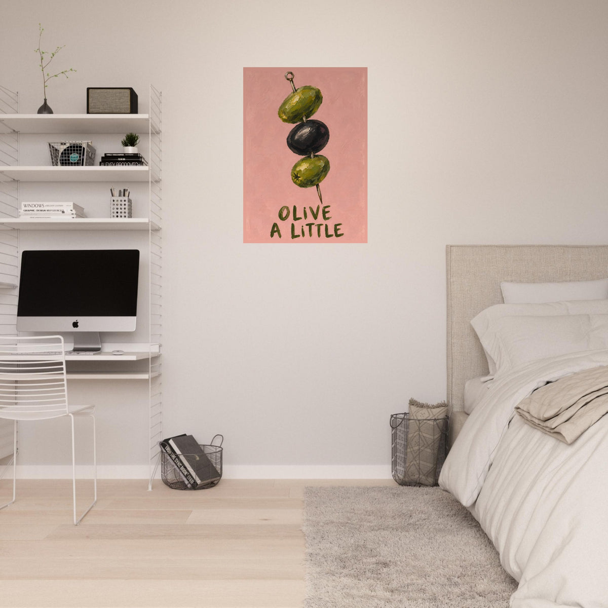 Olive a Little print on a pale bedroom wall above a desk, beside shelves, a bed and a tall window.