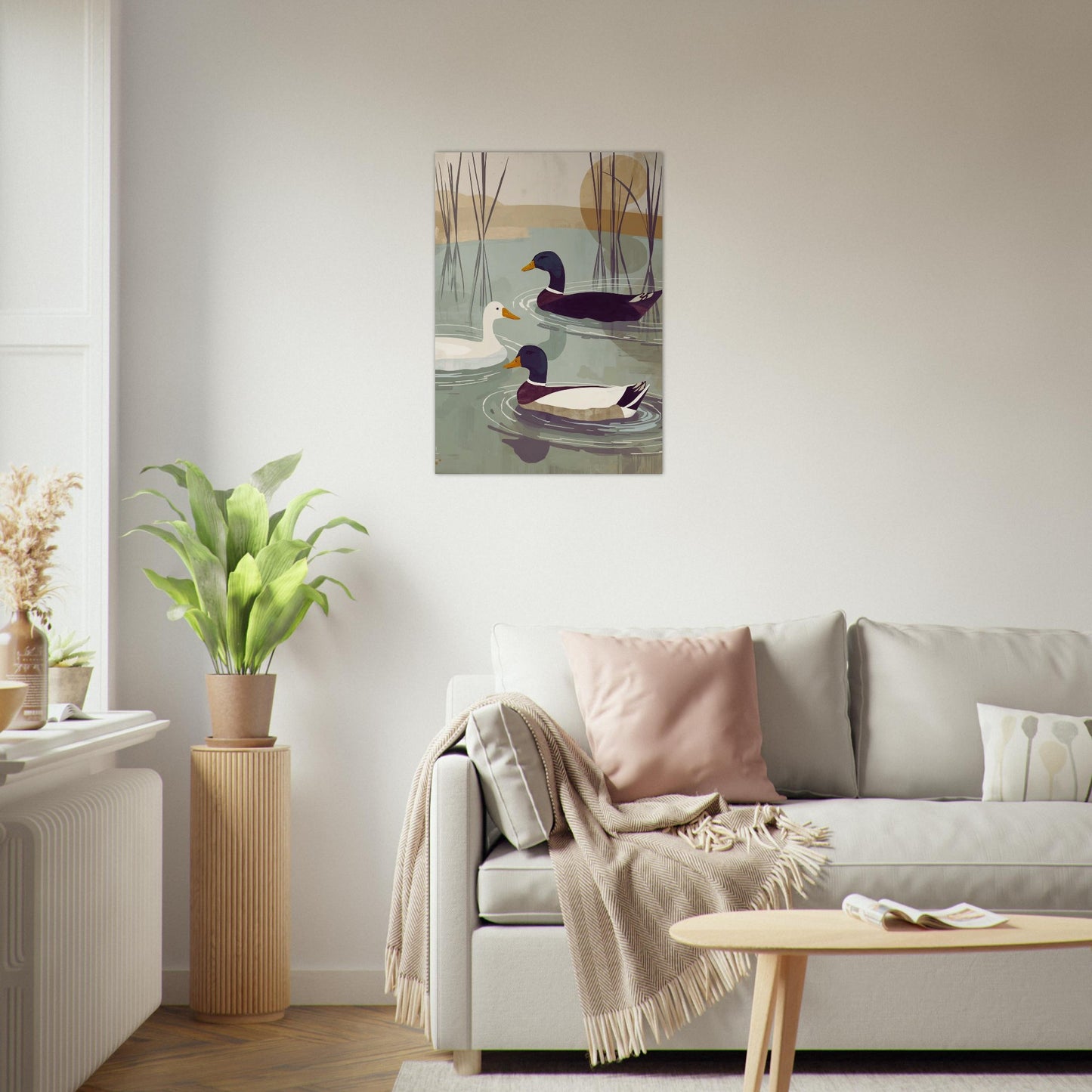 Living room with a sofa, coffee table, and wall art of ducks.