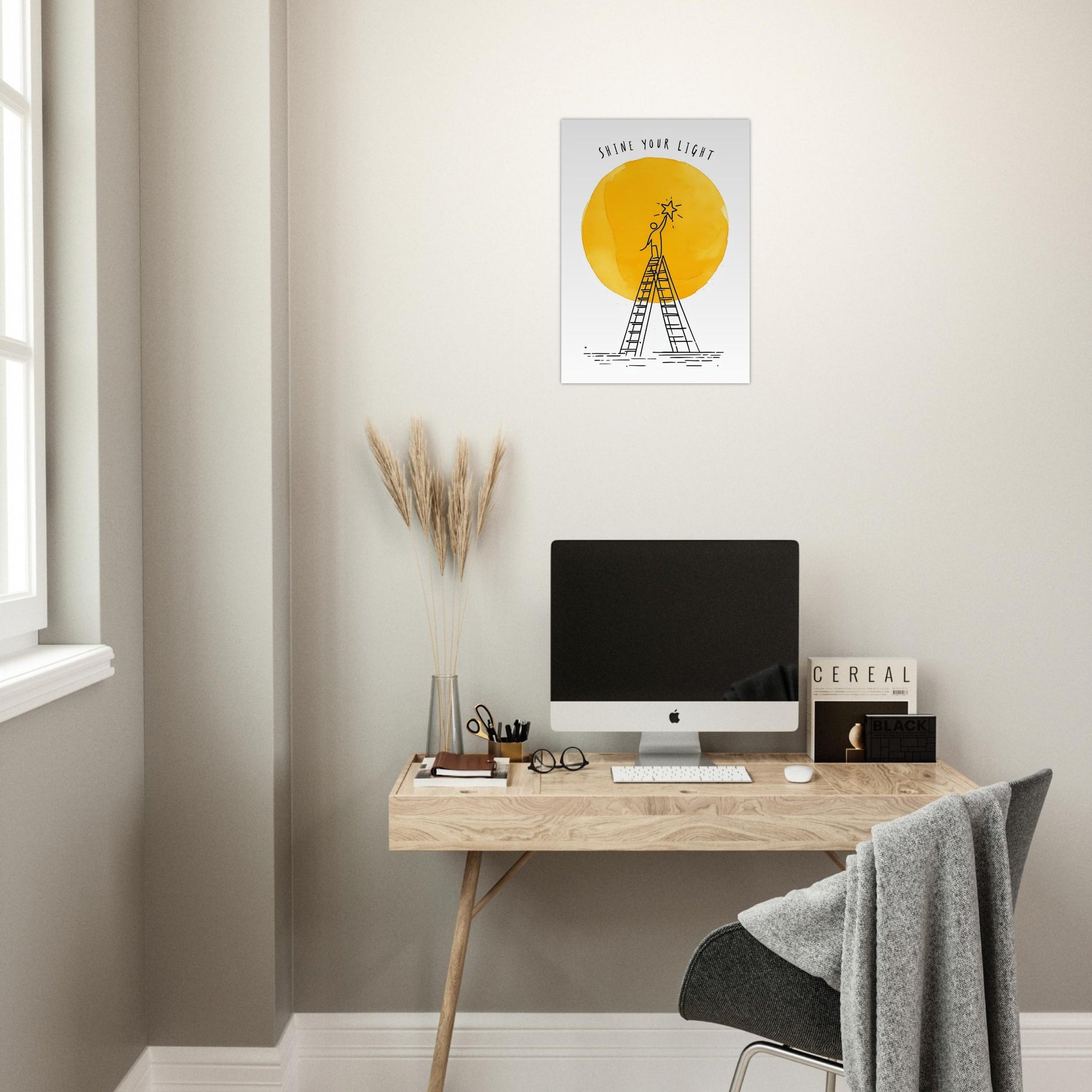 Modern home office with a desk, computer, and wall art.