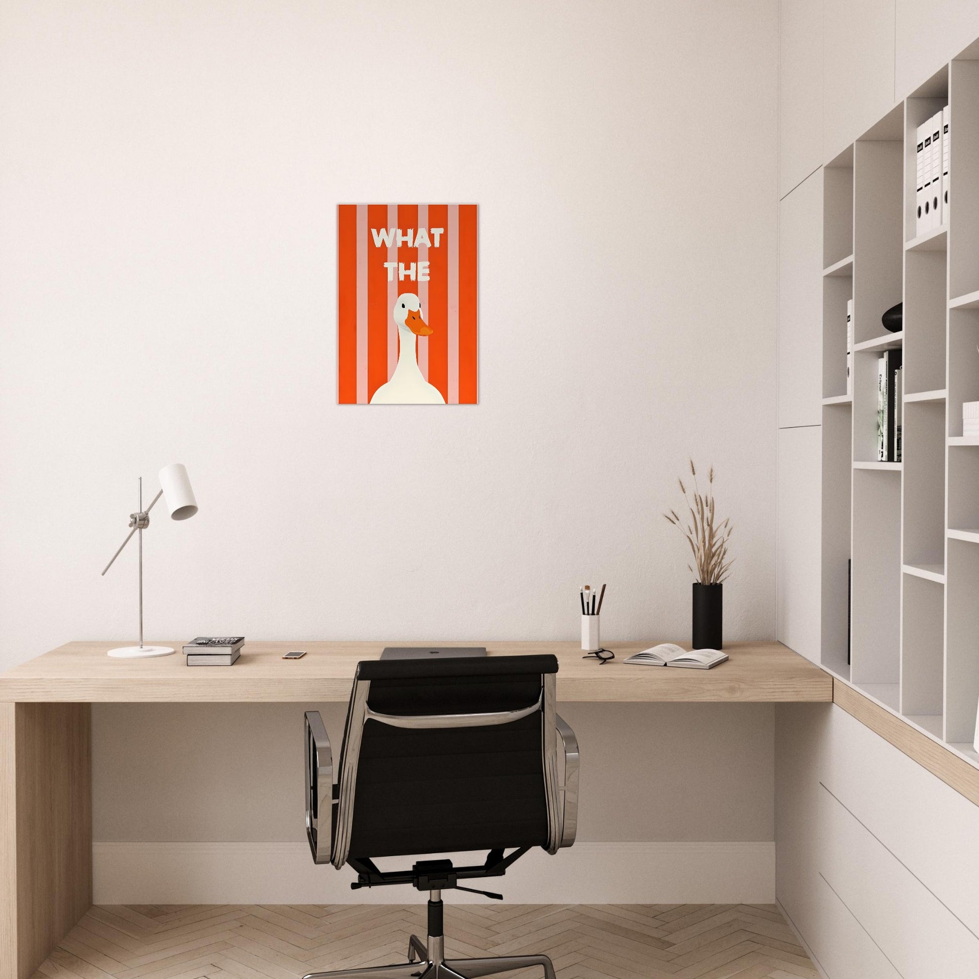 Modern office setup with a desk, chair, and wall art.
