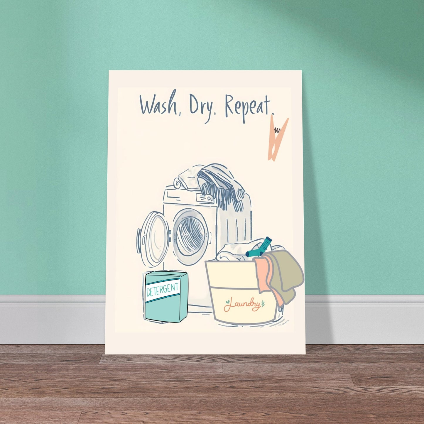 Poster with a laundry-themed illustration and text 'Wash. Dry. Repeat.' on a teal wall.