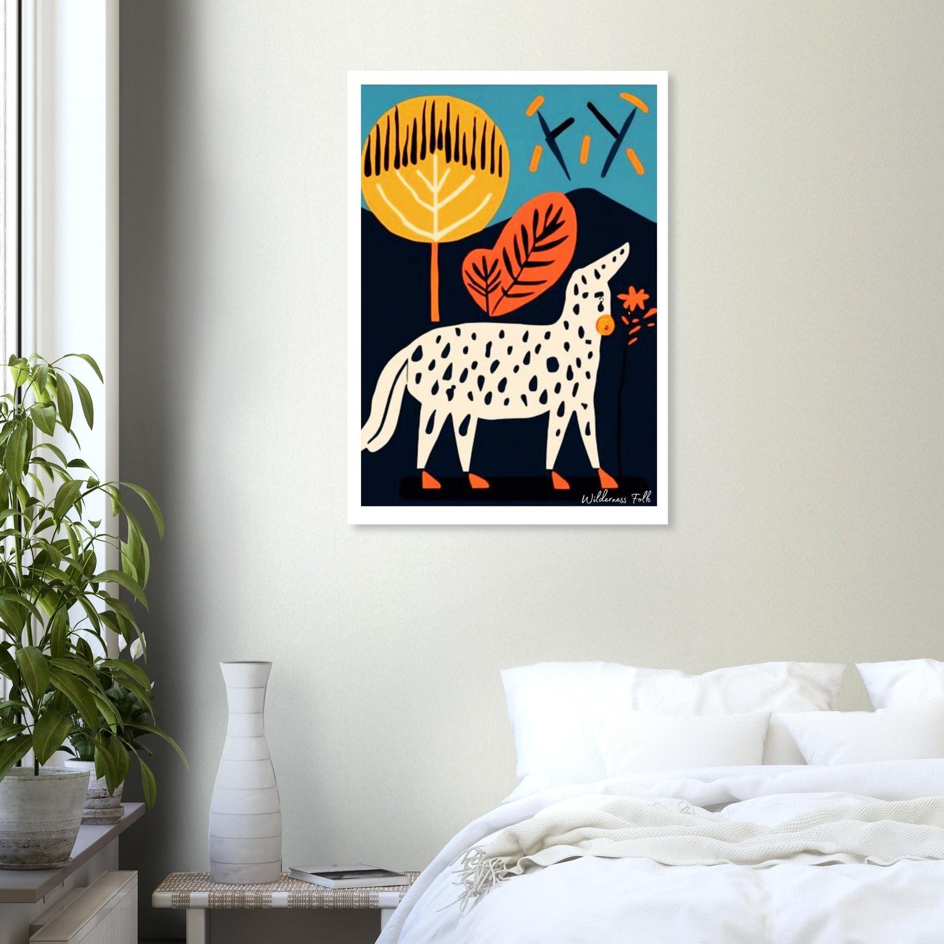 Framed abstract art print of a dog and leaves on a wall above a bed.