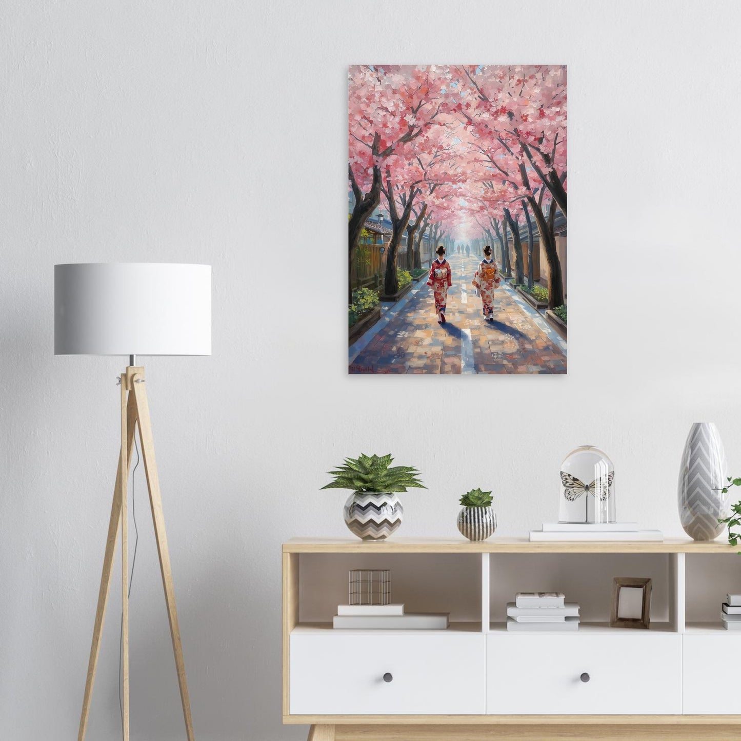 Cherry blossom wall art print displayed above a sideboard with a modern lamp and ornaments displayed