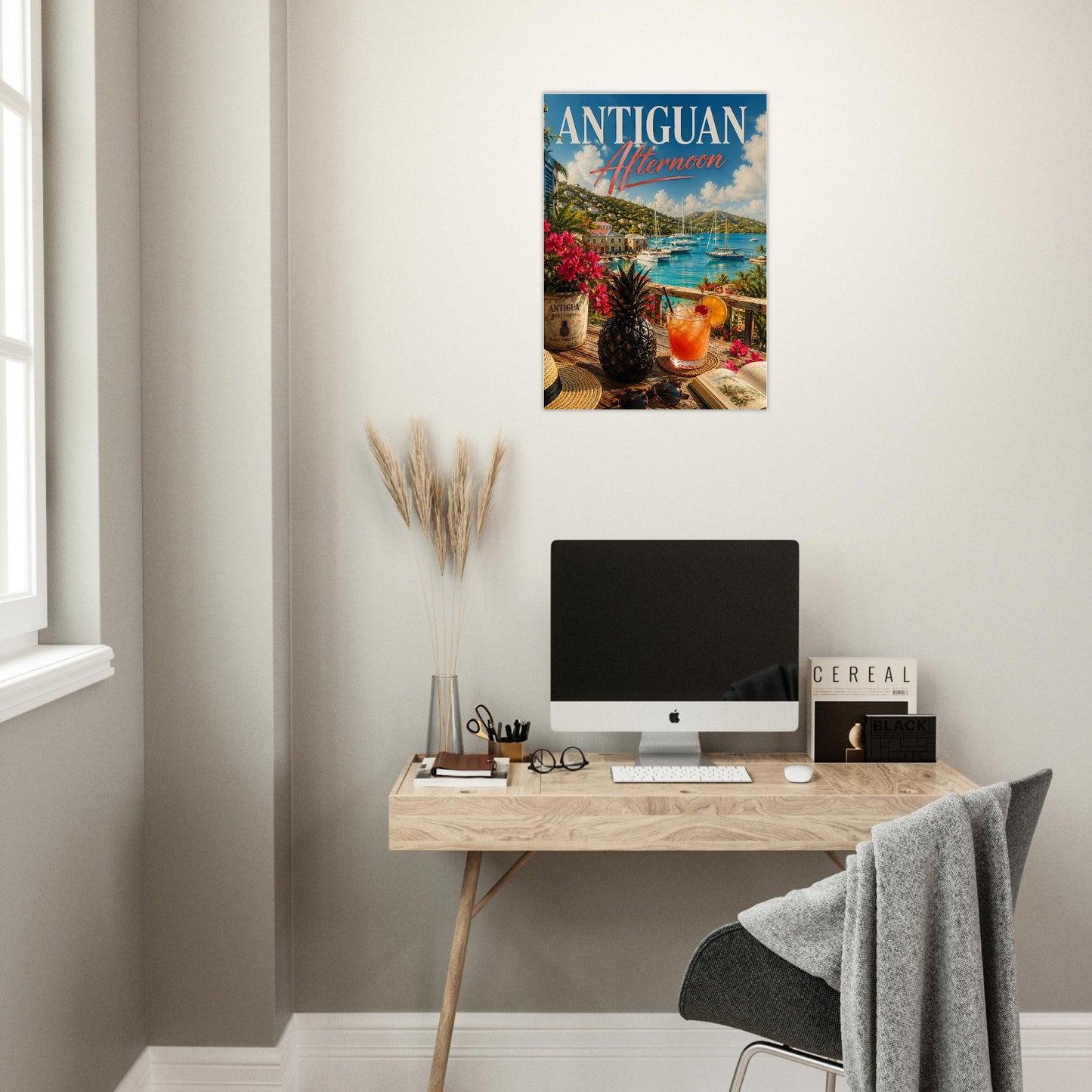 Home office with a desk, computer, and wall art of Antigua.